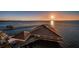 Modern clubhouse with a copper roof located on the waterfront at sunset at 632 Edgewater Dr # 439, Dunedin, FL 34698