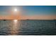Scenic sunset over calm waters with boats at 632 Edgewater Dr # 439, Dunedin, FL 34698