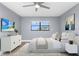 Spacious bedroom with ceiling fan and large window at 7050 Sunset S Dr # 211, South Pasadena, FL 33707