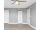 Bedroom with wood flooring and double door closet at 7050 Sunset S Dr # 211, South Pasadena, FL 33707