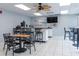 Community lounge with kitchenette, TV, and comfortable seating at 7050 Sunset S Dr # 211, South Pasadena, FL 33707