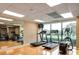 Modern gym with treadmills, elliptical trainers, and a view at 7050 Sunset S Dr # 211, South Pasadena, FL 33707