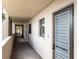 Building hallway with access to individual units at 7050 Sunset S Dr # 211, South Pasadena, FL 33707