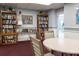 Quiet library with bookshelves, comfortable seating, and a table at 7050 Sunset S Dr # 211, South Pasadena, FL 33707