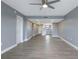 Open living area with grey walls and wood-look floors at 7050 Sunset S Dr # 211, South Pasadena, FL 33707
