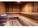 Relax in this spacious cedarwood sauna with benches and a metal bucket at 7050 Sunset S Dr # 211, South Pasadena, FL 33707