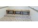 Clean and bright shower area with tiled walls and wooden benches at 7050 Sunset S Dr # 211, South Pasadena, FL 33707