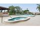 Community spa and pool area with ample seating at 7050 Sunset S Dr # 211, South Pasadena, FL 33707