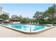 Inviting community pool with tranquil waterfront views at 7050 Sunset S Dr # 211, South Pasadena, FL 33707