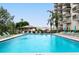 Refreshing community pool with plenty of lounge space at 7050 Sunset S Dr # 211, South Pasadena, FL 33707