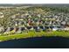 Aerial view of house and neighborhood; desirable location by the lake at 8111 Tar Hollow Dr, Gibsonton, FL 33534