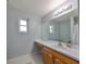 Bathroom with single sink and wood vanity at 8111 Tar Hollow Dr, Gibsonton, FL 33534