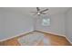 Bedroom with wood flooring, ceiling fan, and a window at 8111 Tar Hollow Dr, Gibsonton, FL 33534