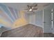Bedroom with ceiling fan and double doors at 8111 Tar Hollow Dr, Gibsonton, FL 33534