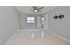 Spacious bedroom with wood flooring, ceiling fan and access to a patio at 8111 Tar Hollow Dr, Gibsonton, FL 33534