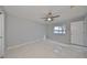 Bright bedroom with tile flooring, ceiling fan, and a water view at 8111 Tar Hollow Dr, Gibsonton, FL 33534