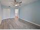 Bedroom with ceiling fan and access to loft at 8111 Tar Hollow Dr, Gibsonton, FL 33534