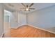 Light-filled bedroom with wood floors and double-door closet at 8111 Tar Hollow Dr, Gibsonton, FL 33534