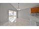 Bright dining area with sliding glass doors leading to the backyard at 8111 Tar Hollow Dr, Gibsonton, FL 33534