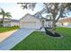 Two-story house with attached garage and landscaped lawn at 8111 Tar Hollow Dr, Gibsonton, FL 33534
