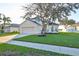 Two-story house with attached garage and landscaped lawn at 8111 Tar Hollow Dr, Gibsonton, FL 33534