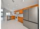 Modern kitchen featuring stainless steel appliances and light wood cabinets at 8111 Tar Hollow Dr, Gibsonton, FL 33534