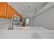 Kitchen with wood cabinets, white countertops and stainless steel appliances at 8111 Tar Hollow Dr, Gibsonton, FL 33534