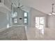 Living room with vaulted ceiling,water view, and sliding doors to patio at 8111 Tar Hollow Dr, Gibsonton, FL 33534