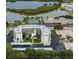 Aerial view of building, tennis court, and pool at 9860 62Nd N Ter # 1013, St Petersburg, FL 33708
