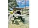 Community BBQ area with picnic tables at 9860 62Nd N Ter # 1013, St Petersburg, FL 33708