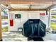 Community BBQ grill area with covered shelter and seating at 9860 62Nd N Ter # 1013, St Petersburg, FL 33708