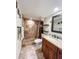 Recently updated bathroom with a walk-in shower, new toilet, and modern vanity at 9860 62Nd N Ter # 1013, St Petersburg, FL 33708