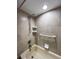 Bathroom with shower/tub combo and grab bar at 9860 62Nd N Ter # 1013, St Petersburg, FL 33708