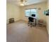 Home office in bright bedroom with window and ceiling fan at 9860 62Nd N Ter # 1013, St Petersburg, FL 33708