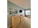 Bedroom with two dressers, TV, and relaxing ocean decor at 9860 62Nd N Ter # 1013, St Petersburg, FL 33708