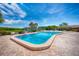 Inviting community pool with lounge chairs and lush landscaping at 9860 62Nd N Ter # 1013, St Petersburg, FL 33708
