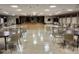 Spacious community room with tables and chairs at 9860 62Nd N Ter # 1013, St Petersburg, FL 33708