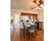 Bright dining area with kitchen passthrough and hardwood floors at 9860 62Nd N Ter # 1013, St Petersburg, FL 33708