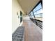 Enclosed patio with seating bench and view of palm trees at 9860 62Nd N Ter # 1013, St Petersburg, FL 33708