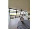 Spacious enclosed patio with water views, table, and ceiling fan at 9860 62Nd N Ter # 1013, St Petersburg, FL 33708