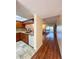 Kitchen and living area visible from entryway with wood flooring at 9860 62Nd N Ter # 1013, St Petersburg, FL 33708