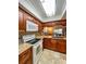 Updated kitchen with granite countertops and wood cabinets at 9860 62Nd N Ter # 1013, St Petersburg, FL 33708
