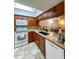 Updated kitchen with granite countertops and wood cabinets at 9860 62Nd N Ter # 1013, St Petersburg, FL 33708