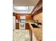Modern kitchen with granite countertops and stainless steel appliances at 9860 62Nd N Ter # 1013, St Petersburg, FL 33708