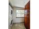 Laundry room with stacked washer and dryer, and built in cabinets at 9860 62Nd N Ter # 1013, St Petersburg, FL 33708