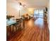 Spacious living room with hardwood floors, access to balcony at 9860 62Nd N Ter # 1013, St Petersburg, FL 33708