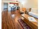 Open living room with hardwood floors and access to patio at 9860 62Nd N Ter # 1013, St Petersburg, FL 33708