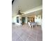 Spacious tiled patio with seating area, perfect for outdoor dining at 9860 62Nd N Ter # 1013, St Petersburg, FL 33708