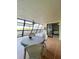 Bright sunroom with ample seating and stunning water views at 9860 62Nd N Ter # 1013, St Petersburg, FL 33708