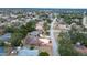 Aerial view of house, neighborhood, and street at 10237 Carrin Rd, Spring Hill, FL 34608